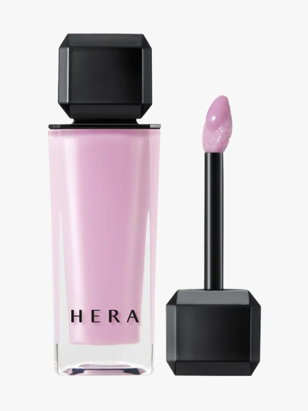 Hera Sensual Nude Gloss in branded component on a light gray background